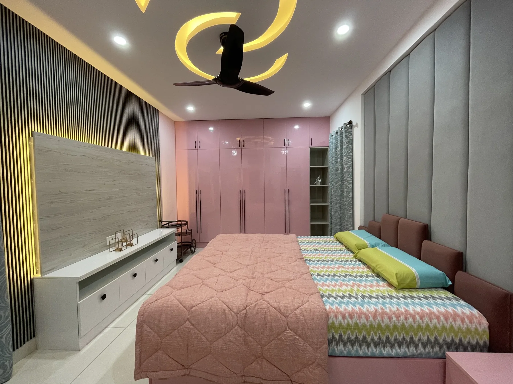 Bedroom with fitted wardrobes and a gold accent ceiling